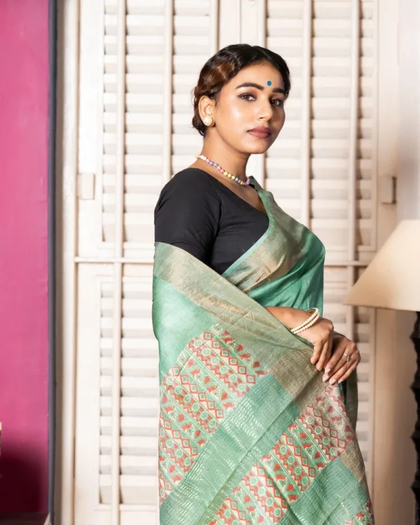 Nakshipar Deep Sea Green & Orange Abstract Print on Sea Green Zari Border Tussar Saree