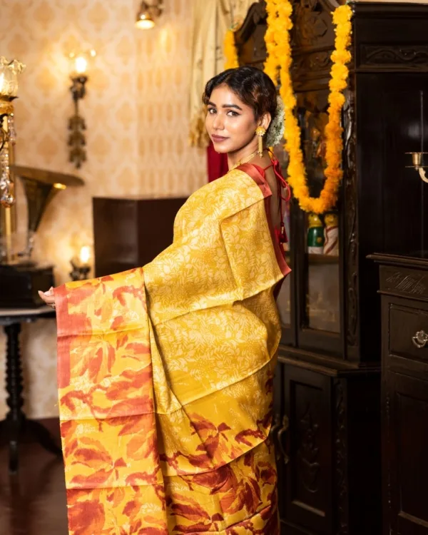 Nakshipar Golden Yellow and Orange print on Yellow Tussar Saree
